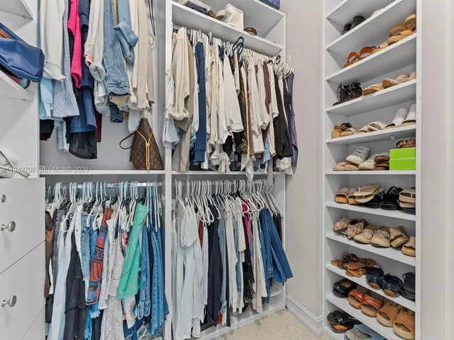 an aerial view of residential houses with outdoor space and street view