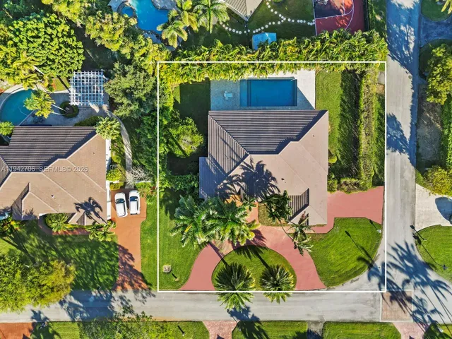 a view of a dining room with furniture and a chandelier