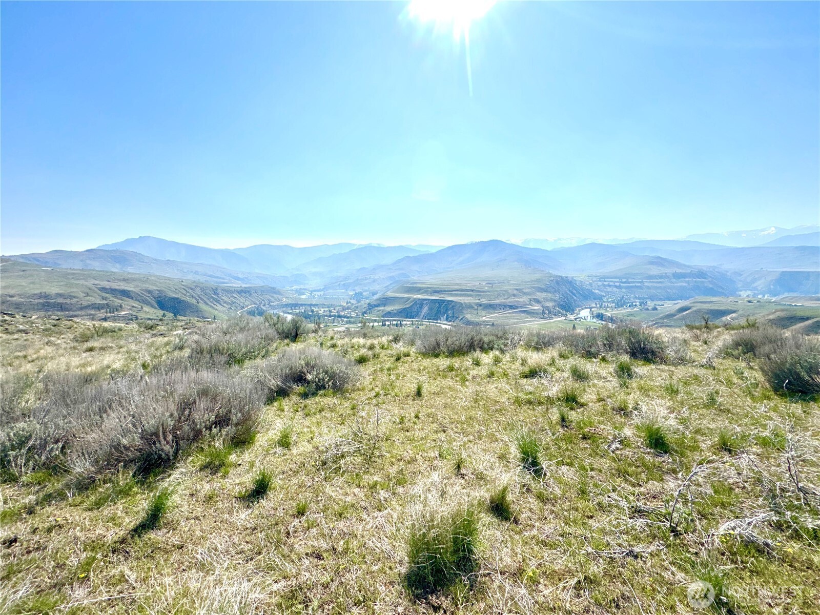 1 Riverbend Overlook Methow, WA 98834 - Photo 17 of 21 a view of a lush green field with mountains in the background
