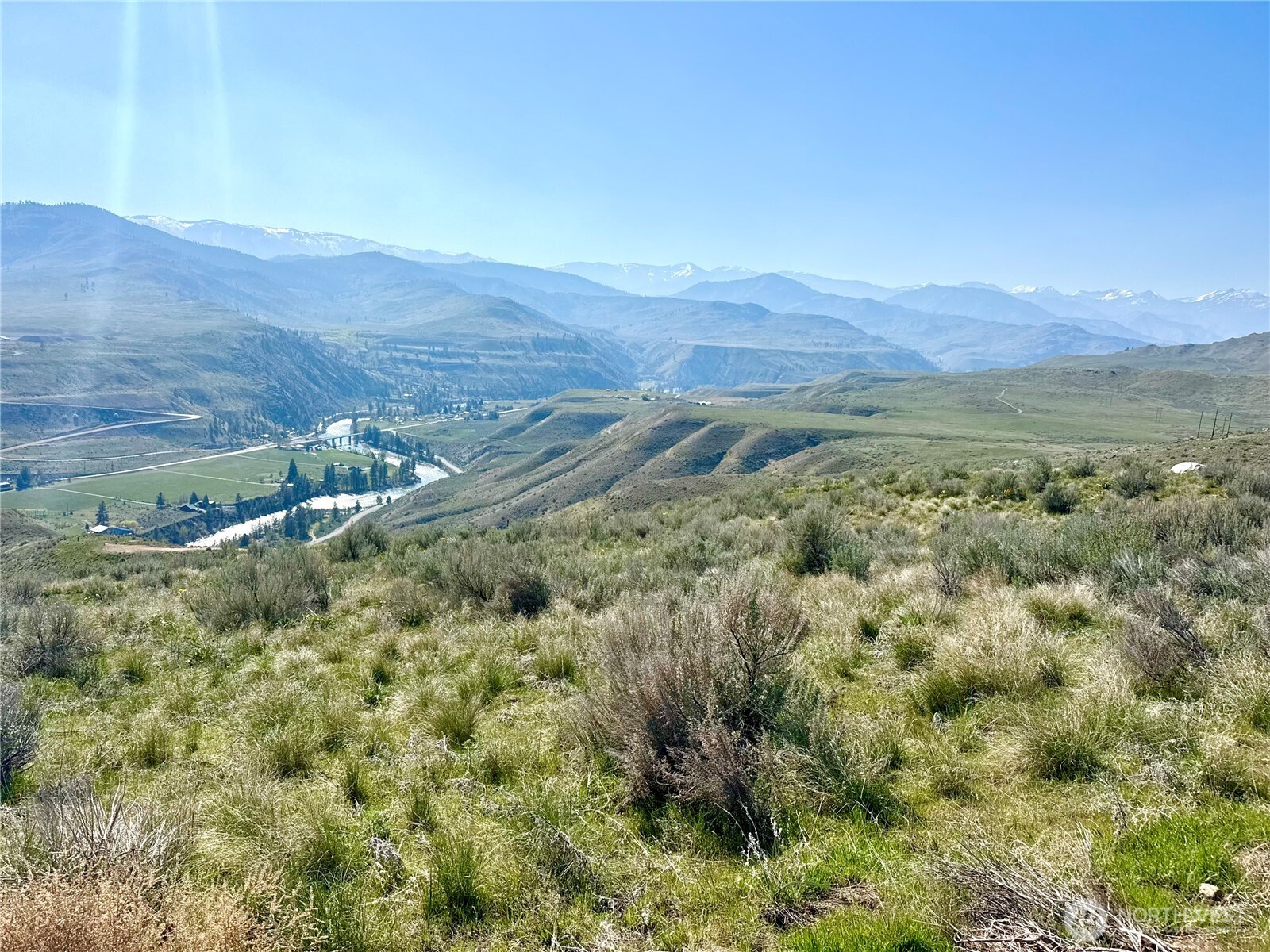 1 Riverbend Overlook Methow, WA 98834 - Photo 6 of 21 a view of a lush green field with lots of bushes