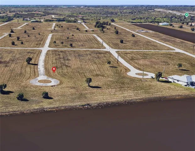 an aerial view of a residential houses with outdoor space