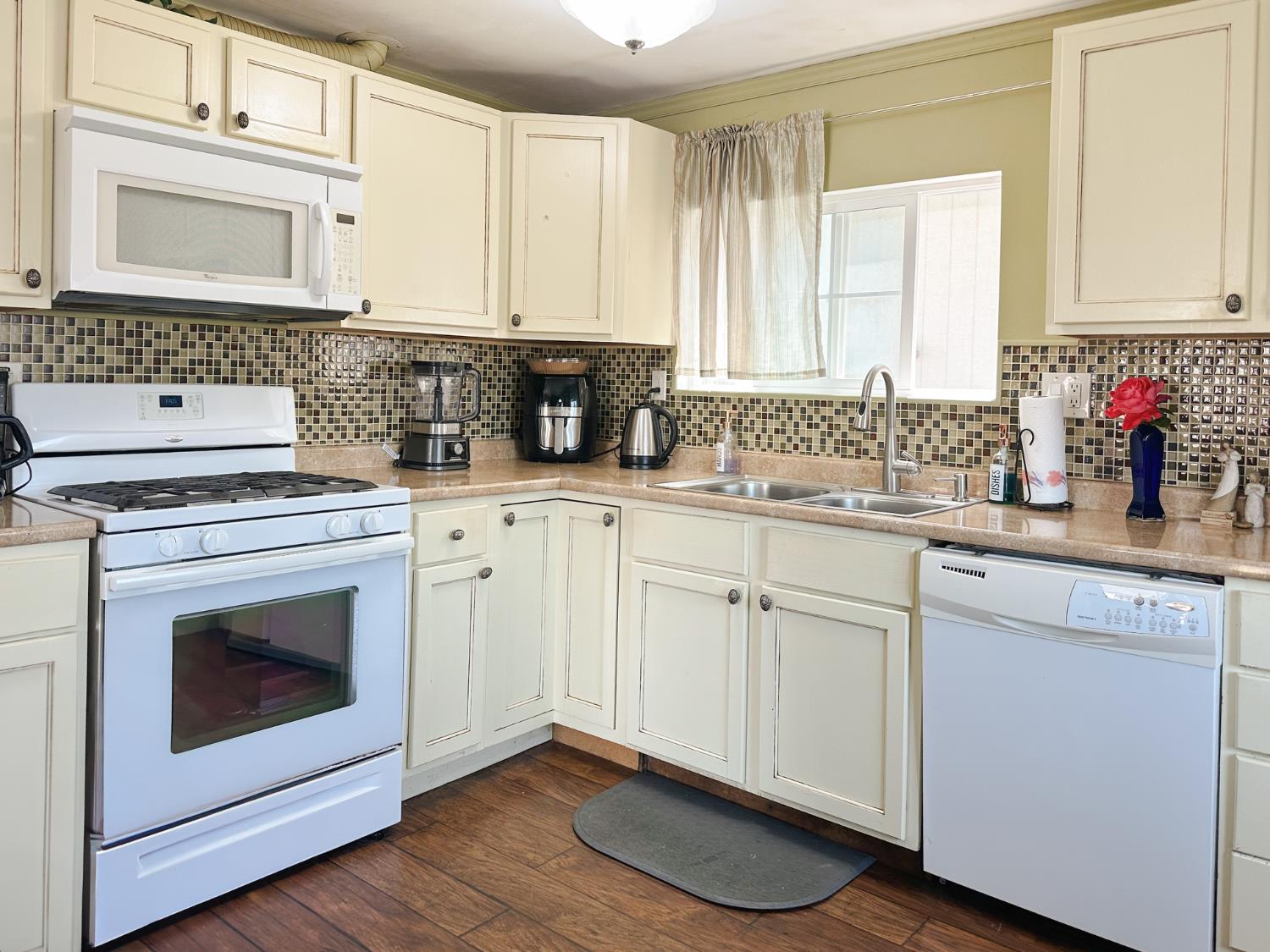 1146 Birch Avenue, Unit 19 Seaside, CA 93955 - Photo 11 of 20 a kitchen with stainless steel appliances granite countertop a sink cabinets and a wooden floor