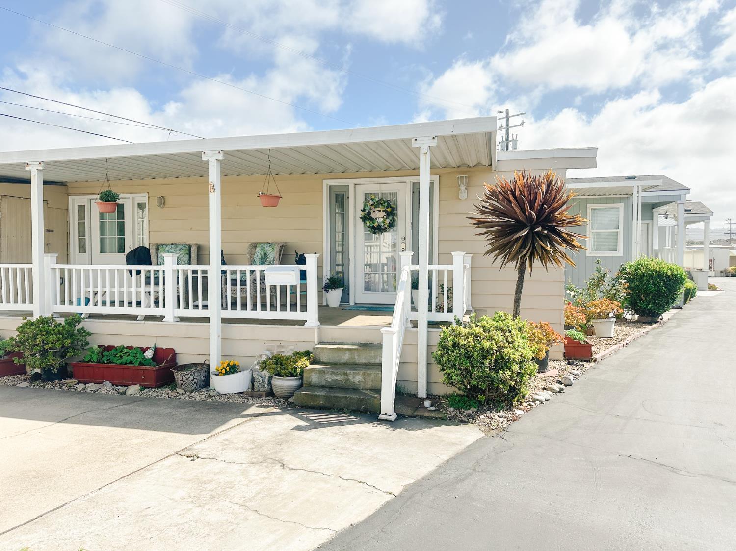 1146 Birch Avenue, Unit 19 Seaside, CA 93955 - Photo 2 of 20 a view of a house with a bench in a patio