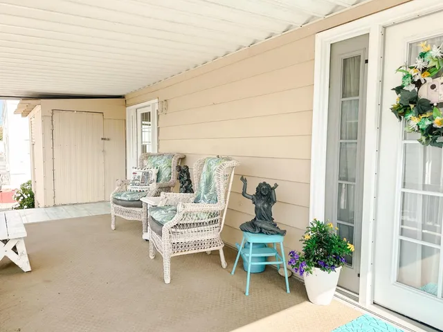 a outdoor space with a couch and chairs