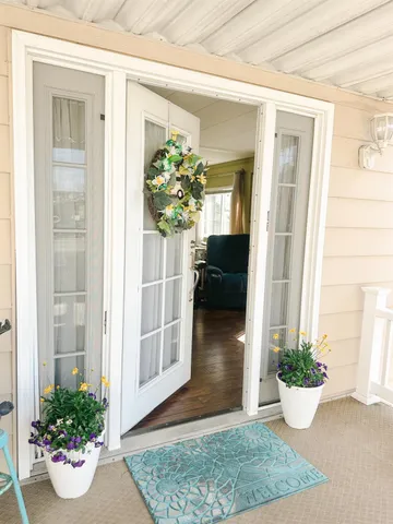 a view of a living room and a potted plant