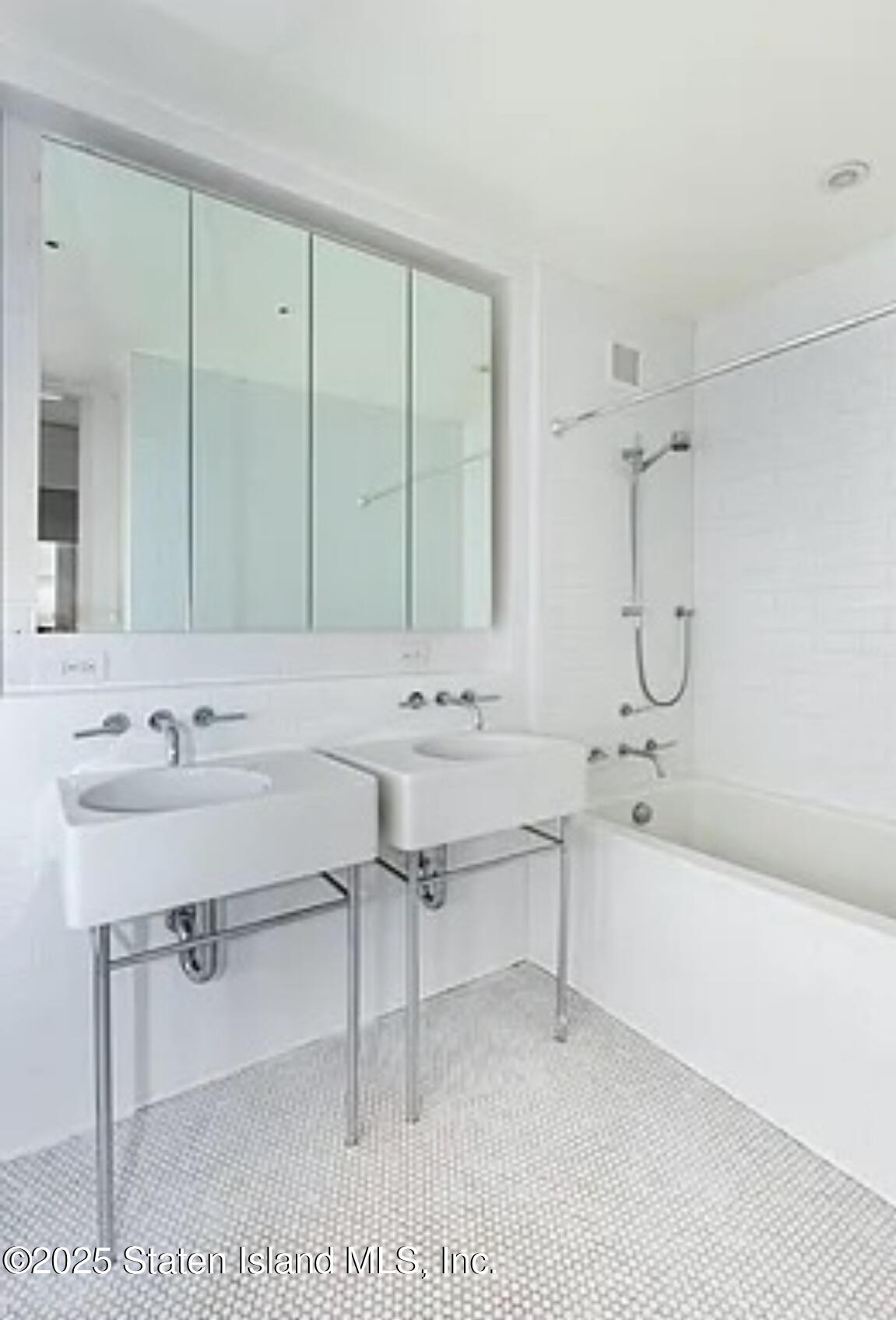 16 West 19th Street, Unit 9F Manhattan, NY 10011 - Photo 20 of 32 a bathroom with a sink and a mirror