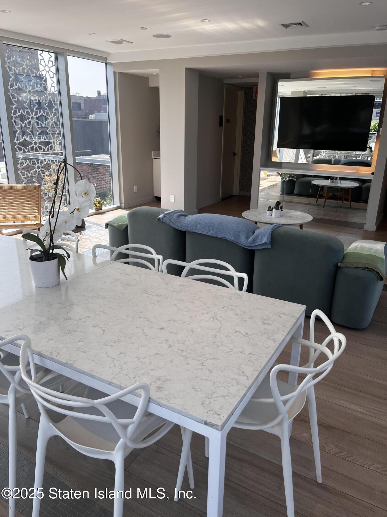 16 West 19th Street, Unit 9F Manhattan, NY 10011 - Photo 29 of 32 a room with furniture and a flat screen tv