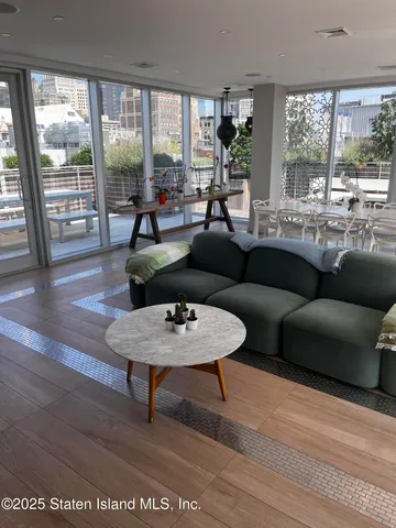 a living room with furniture and a large window
