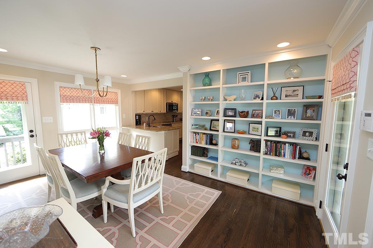 410 Marlowe Road Raleigh, NC 27609 - Photo 12 of 23 a dining room with furniture and a book shelf