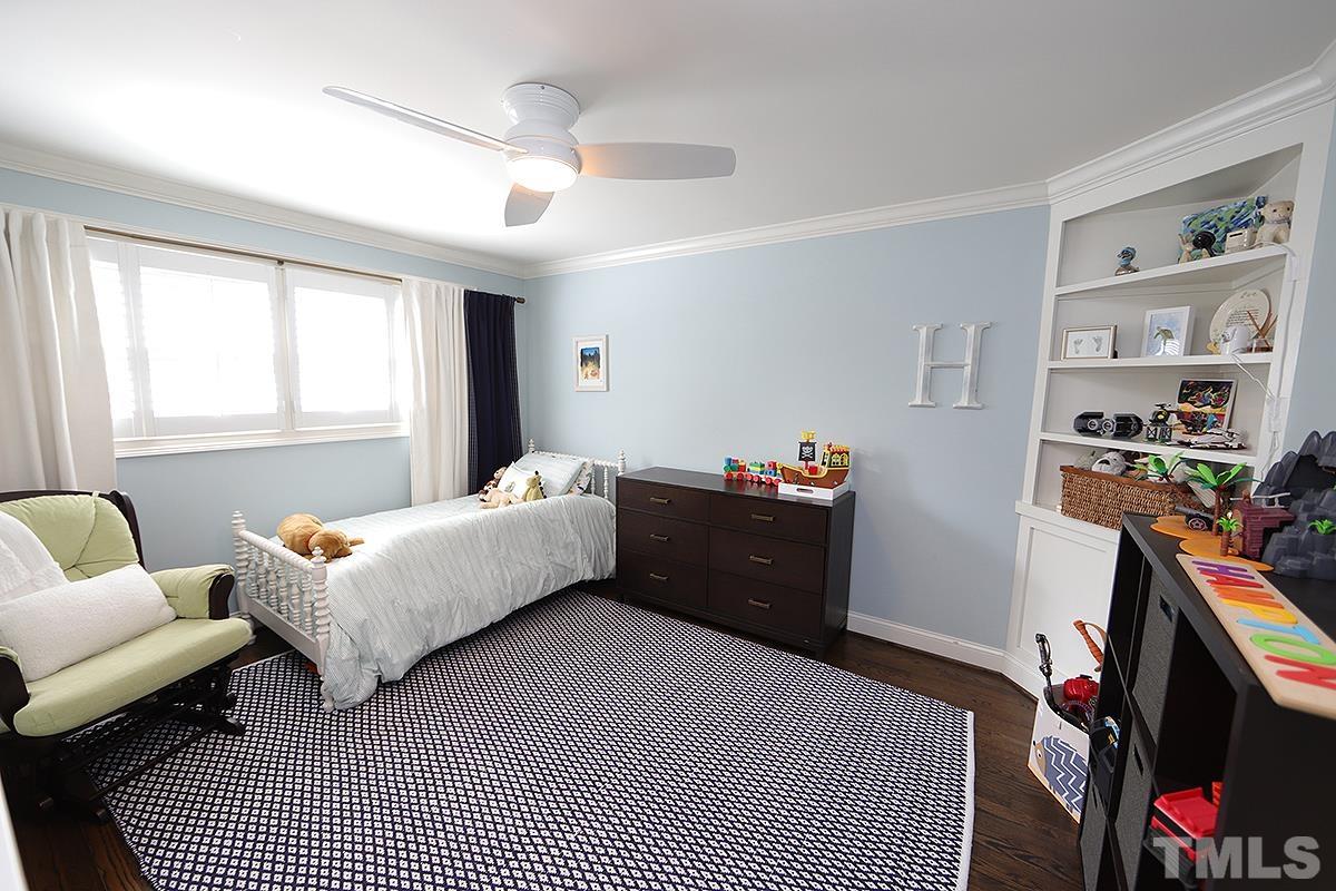 410 Marlowe Road Raleigh, NC 27609 - Photo 17 of 23 a bedroom with a bed and a couch