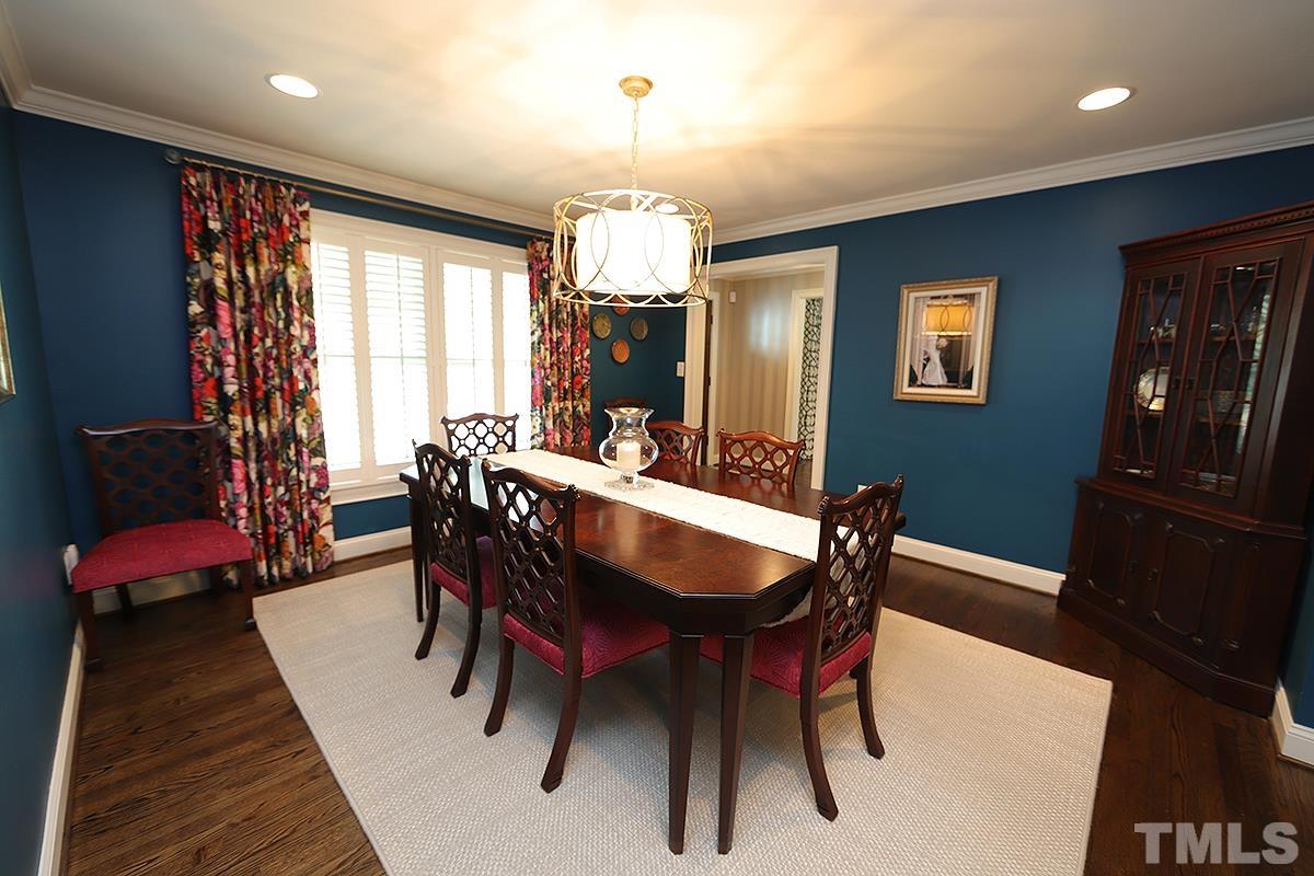 410 Marlowe Road Raleigh, NC 27609 - Photo 4 of 23 a view of a dining room with furniture window and wooden floor