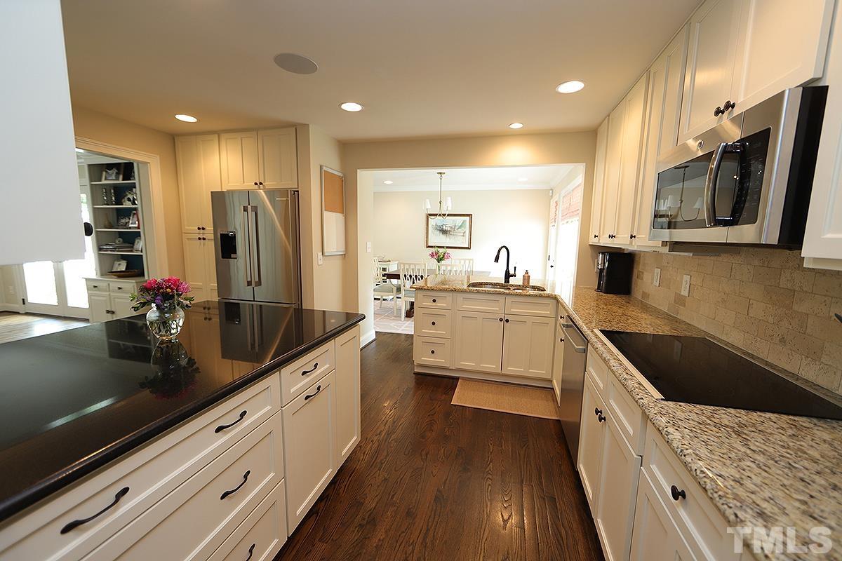 410 Marlowe Road Raleigh, NC 27609 - Photo 10 of 23 a kitchen with a sink stainless steel appliances and cabinets