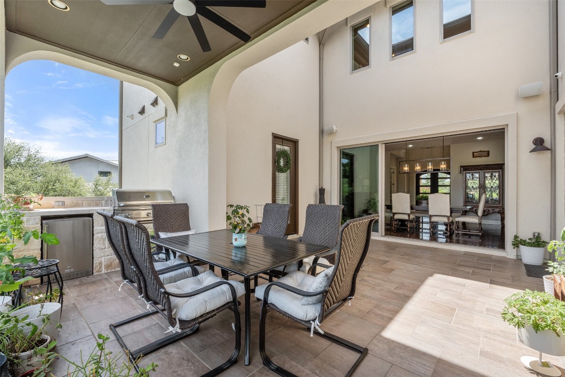 13009 Zen Gardens Way Austin, TX 78732 - Photo 17 of 40 a dining room with furniture and wooden floor