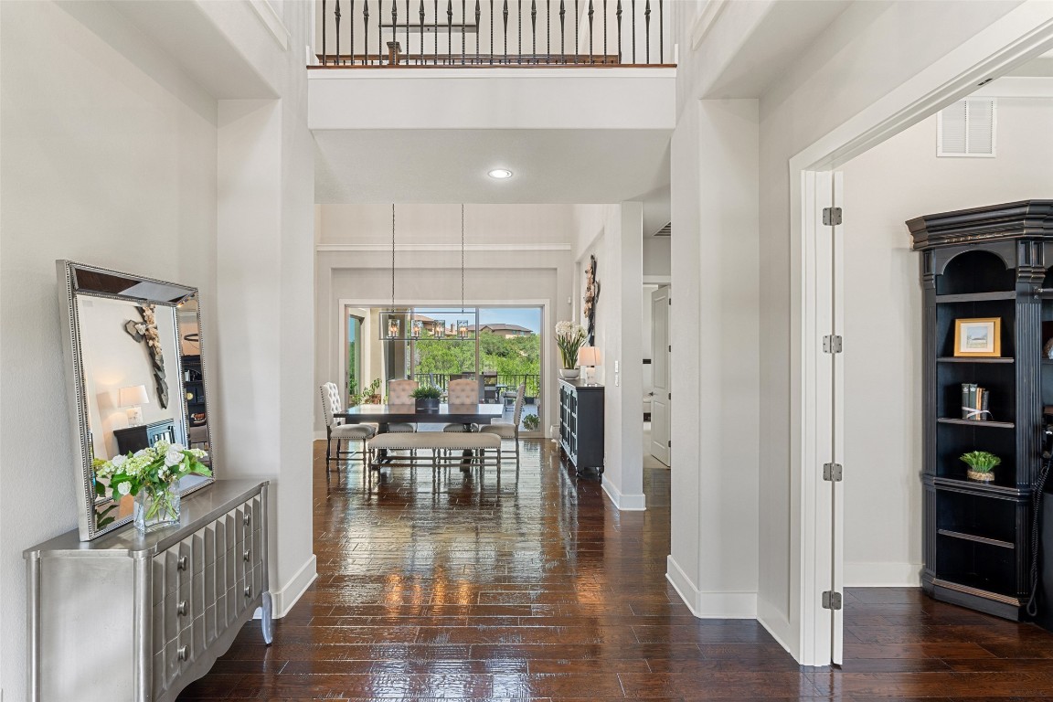 13009 Zen Gardens Way Austin, TX 78732 - Photo 25 of 40 a view of a dining room with furniture window and wooden floor