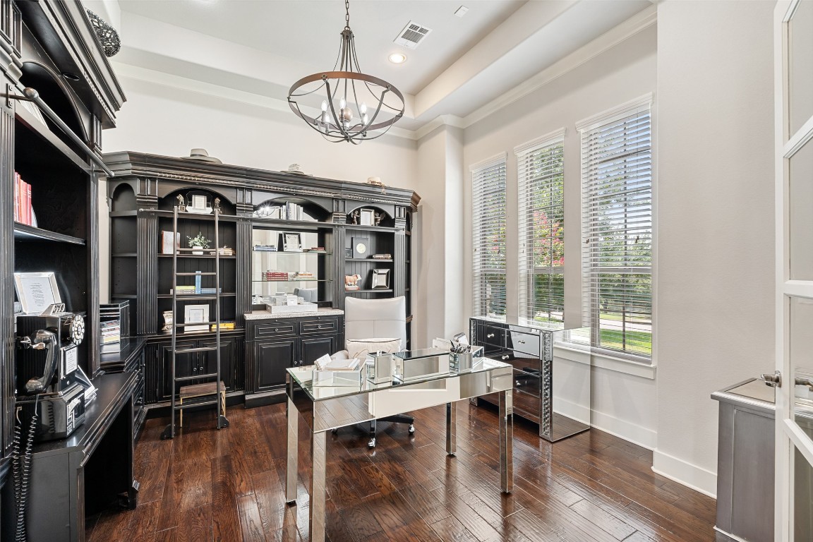13009 Zen Gardens Way Austin, TX 78732 - Photo 26 of 40 a view of a dining room with furniture window and wooden floor