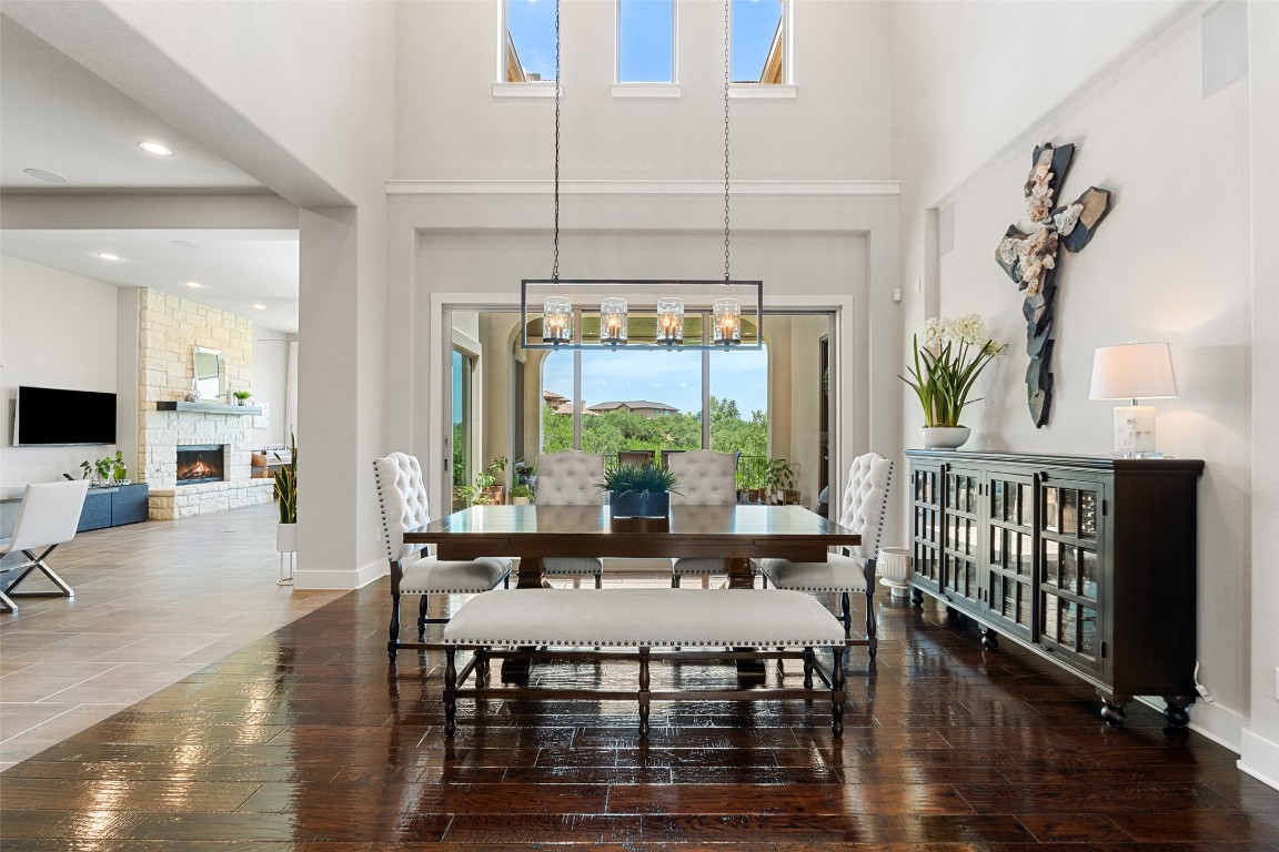 13009 Zen Gardens Way Austin, TX 78732 - Photo 27 of 40 a view of a dining room with furniture window and wooden floor