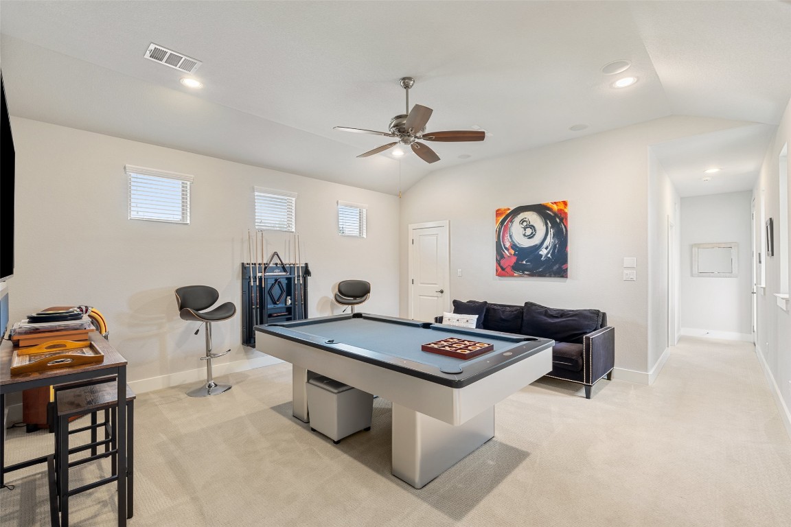 13009 Zen Gardens Way Austin, TX 78732 - Photo 28 of 40 a living room with furniture and a table