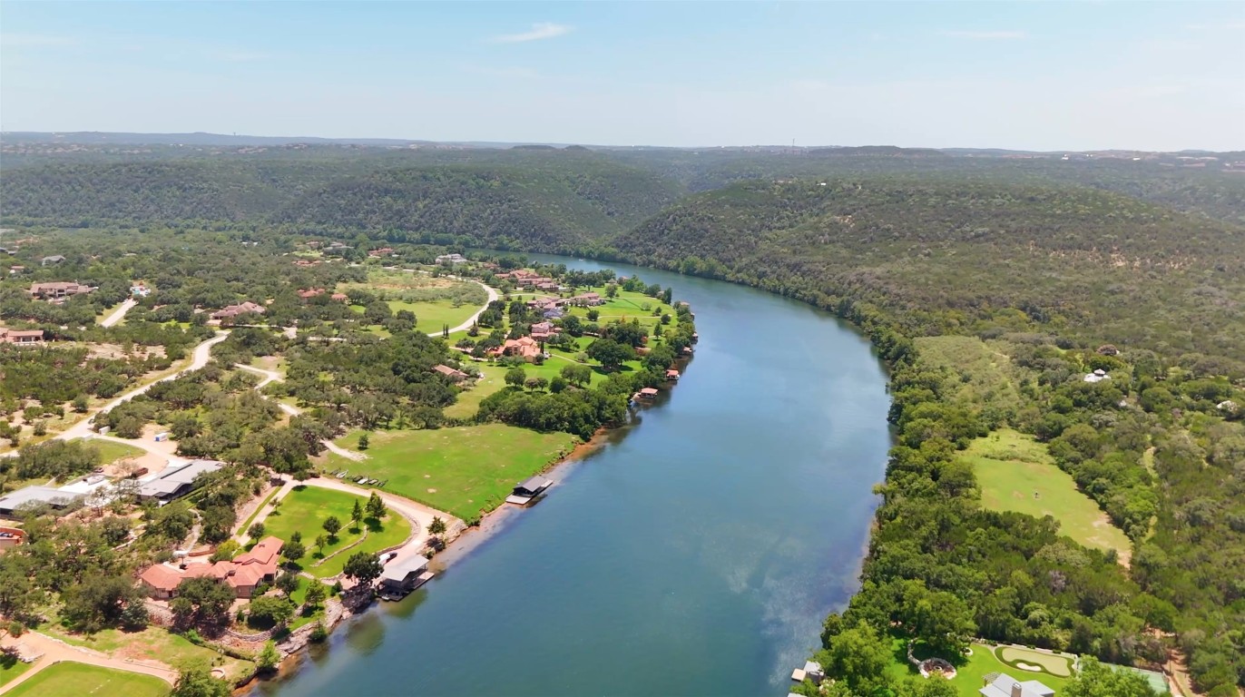 13009 Zen Gardens Way Austin, TX 78732 - Photo 35 of 40 a view of a lake with a mountain in the background
