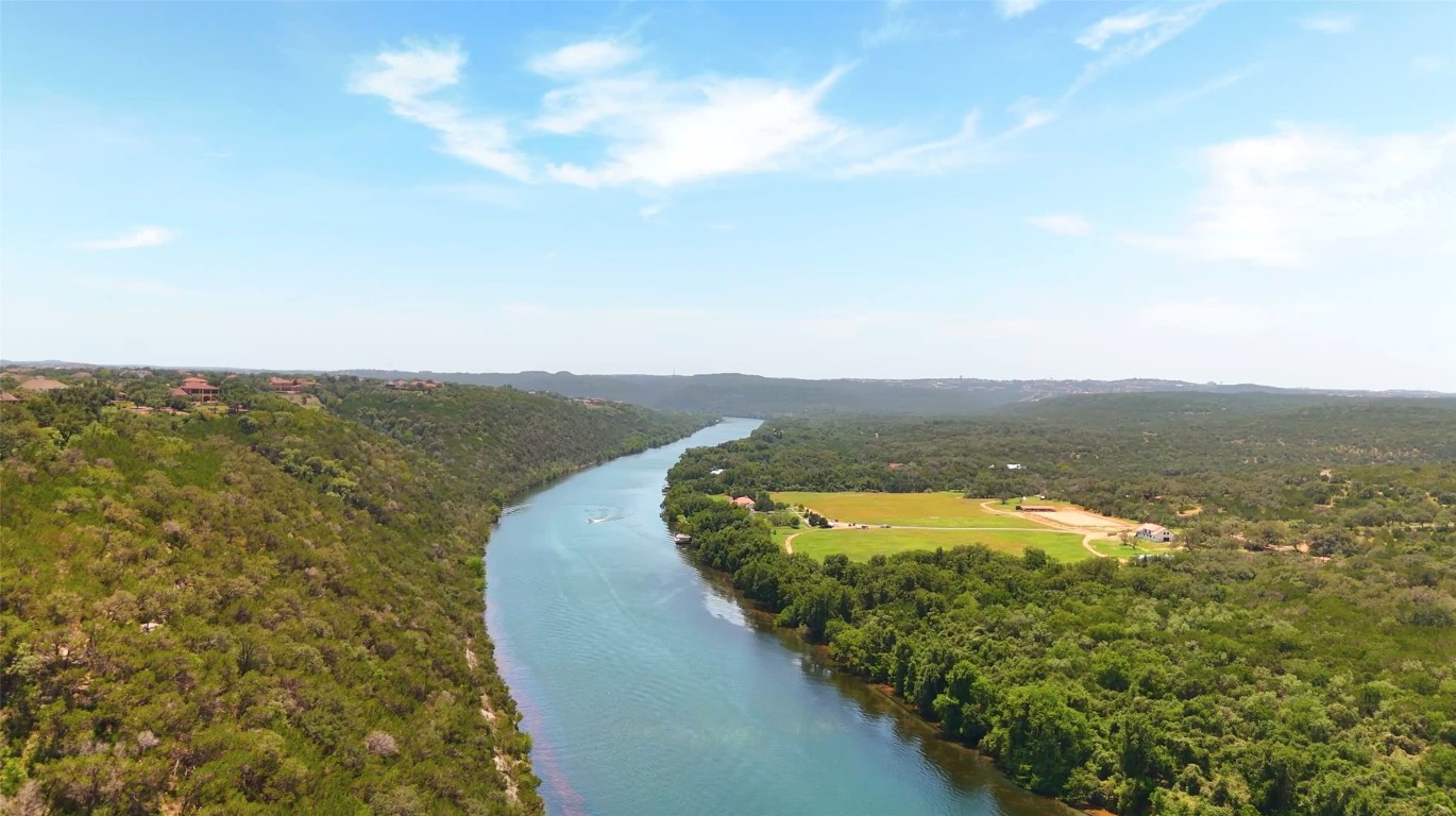13009 Zen Gardens Way Austin, TX 78732 - Photo 36 of 40 a view of a lake with a city
