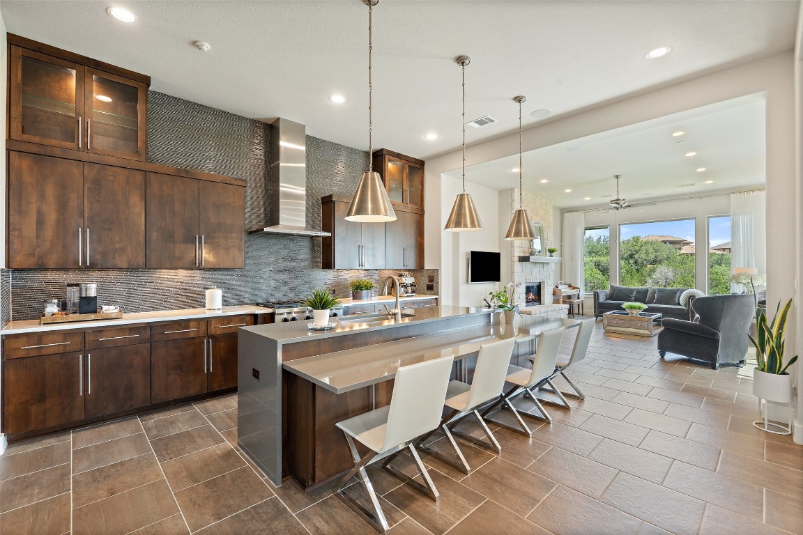 13009 Zen Gardens Way Austin, TX 78732 - Photo 6 of 40 a large kitchen with a table and chairs in it