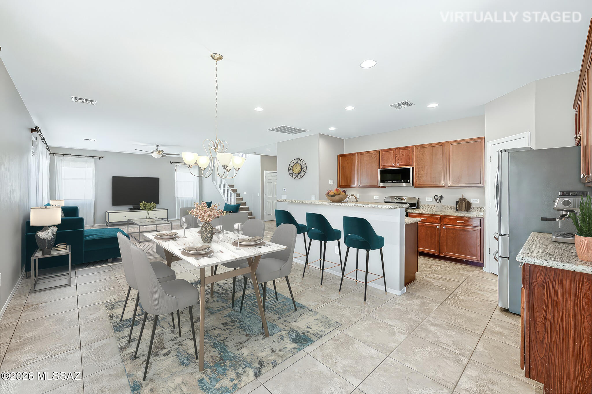 323 East Refuge Loop Vail, AZ 85641 - Photo 7 of 51 a large kitchen with a table and chairs