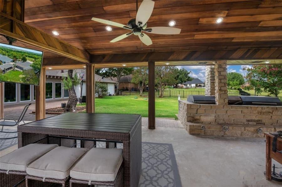 8 Canyon Ridge Drive Fate, TX 75087 - Photo 11 of 40 a view of a patio with a table chairs and a backyard