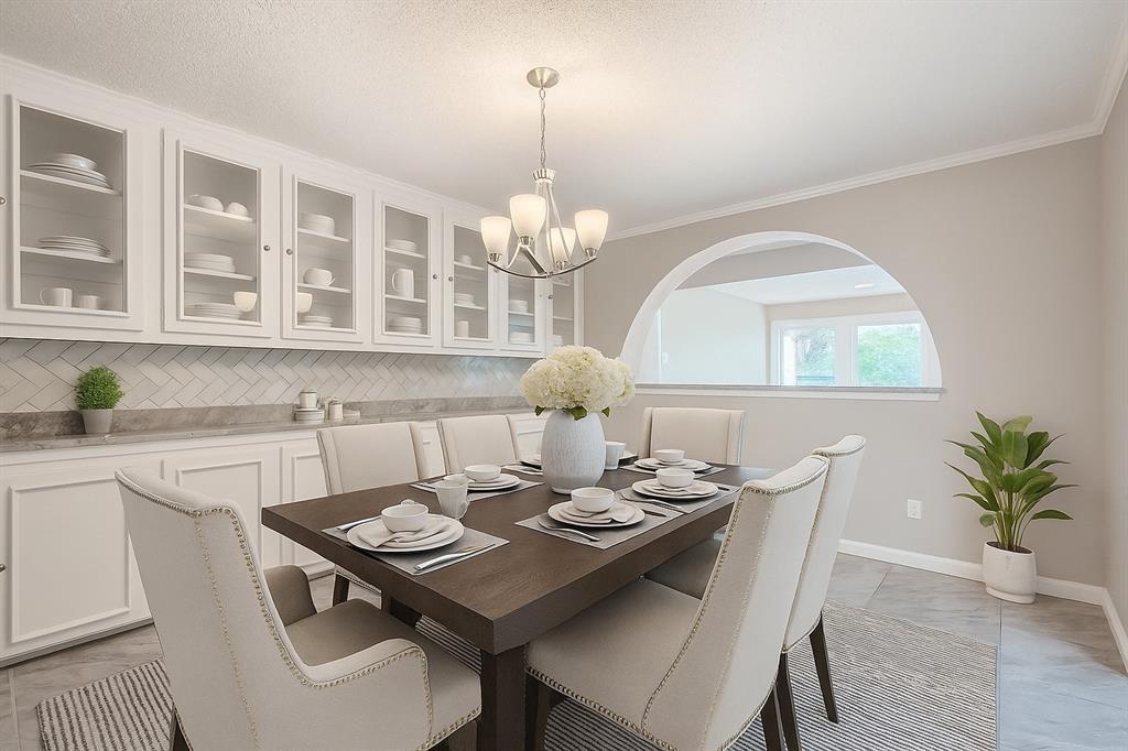 8 Canyon Ridge Drive Fate, TX 75087 - Photo 12 of 40 a view of a dining room with a table and chairs