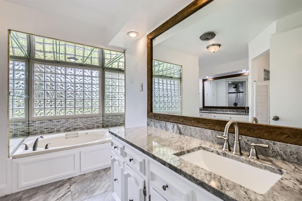 8 Canyon Ridge Drive Fate, TX 75087 - Photo 26 of 40 a bathroom with sink bathtub and double vanity