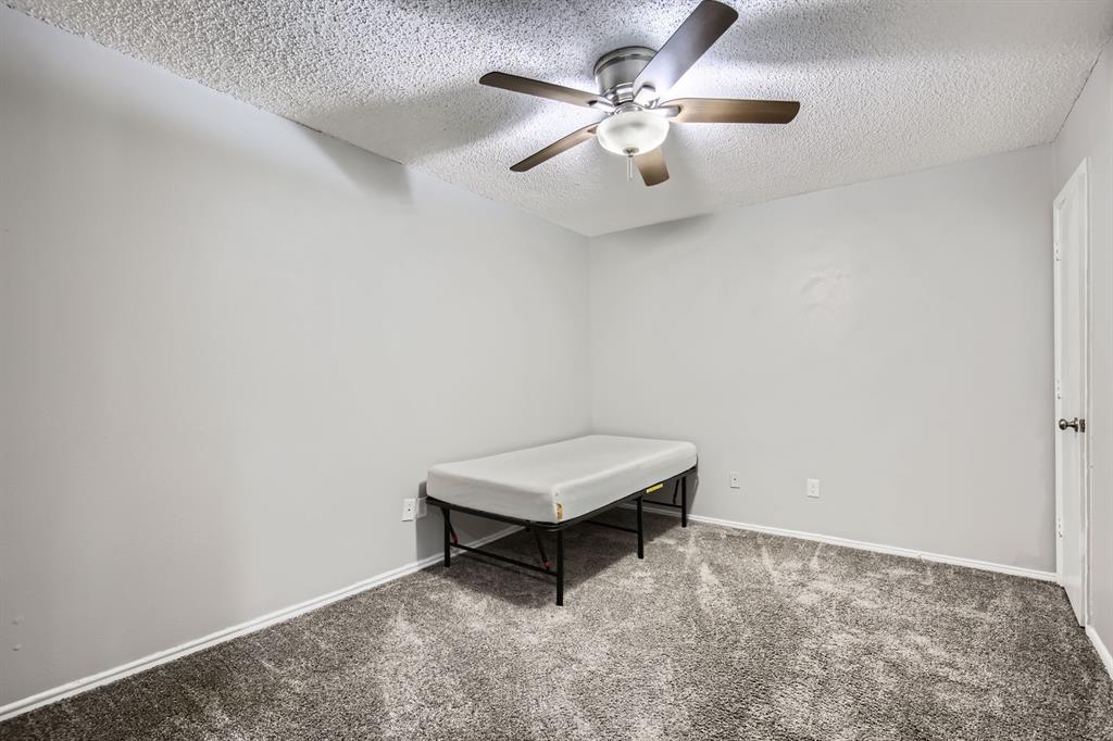 8 Canyon Ridge Drive Fate, TX 75087 - Photo 28 of 40 an empty room with windows and fan