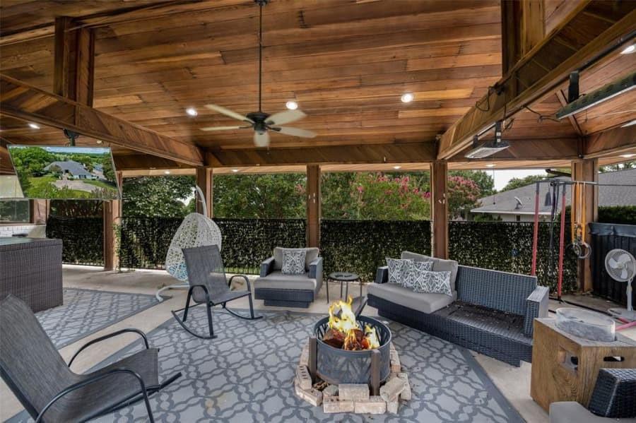 8 Canyon Ridge Drive Fate, TX 75087 - Photo 3 of 40 a living room with patio furniture and a fireplace