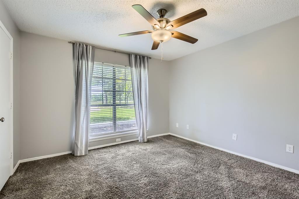 8 Canyon Ridge Drive Fate, TX 75087 - Photo 33 of 40 an empty room with a empty space and a ceiling fan