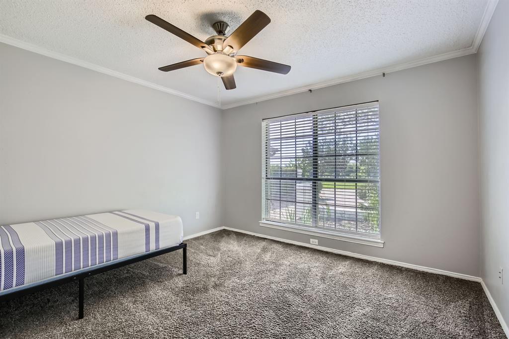 8 Canyon Ridge Drive Fate, TX 75087 - Photo 35 of 40 a view of a livingroom with a ceiling fan and window