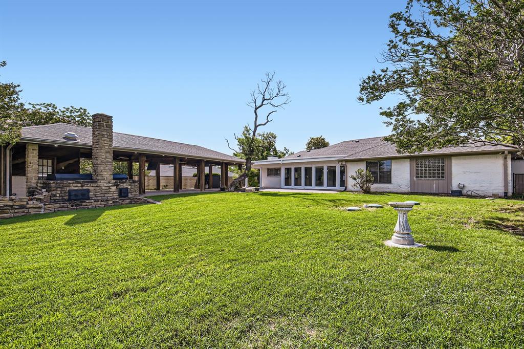 8 Canyon Ridge Drive Fate, TX 75087 - Photo 39 of 40 a front view of house with a garden