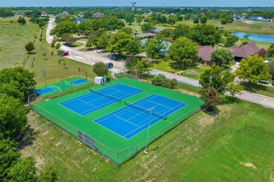 8 Canyon Ridge Drive Fate, TX 75087 - Photo 6 of 40 an aerial view of a tennis ground and a houses