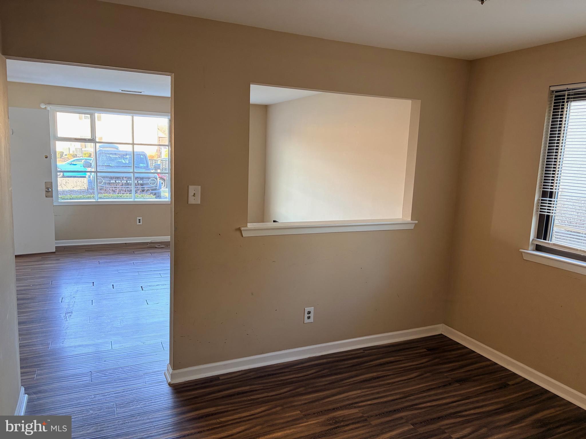2036 Jason Drive, Unit A Huntingdon Valley, PA 19006 - Photo 3 of 10 an empty room with wooden floor and windows