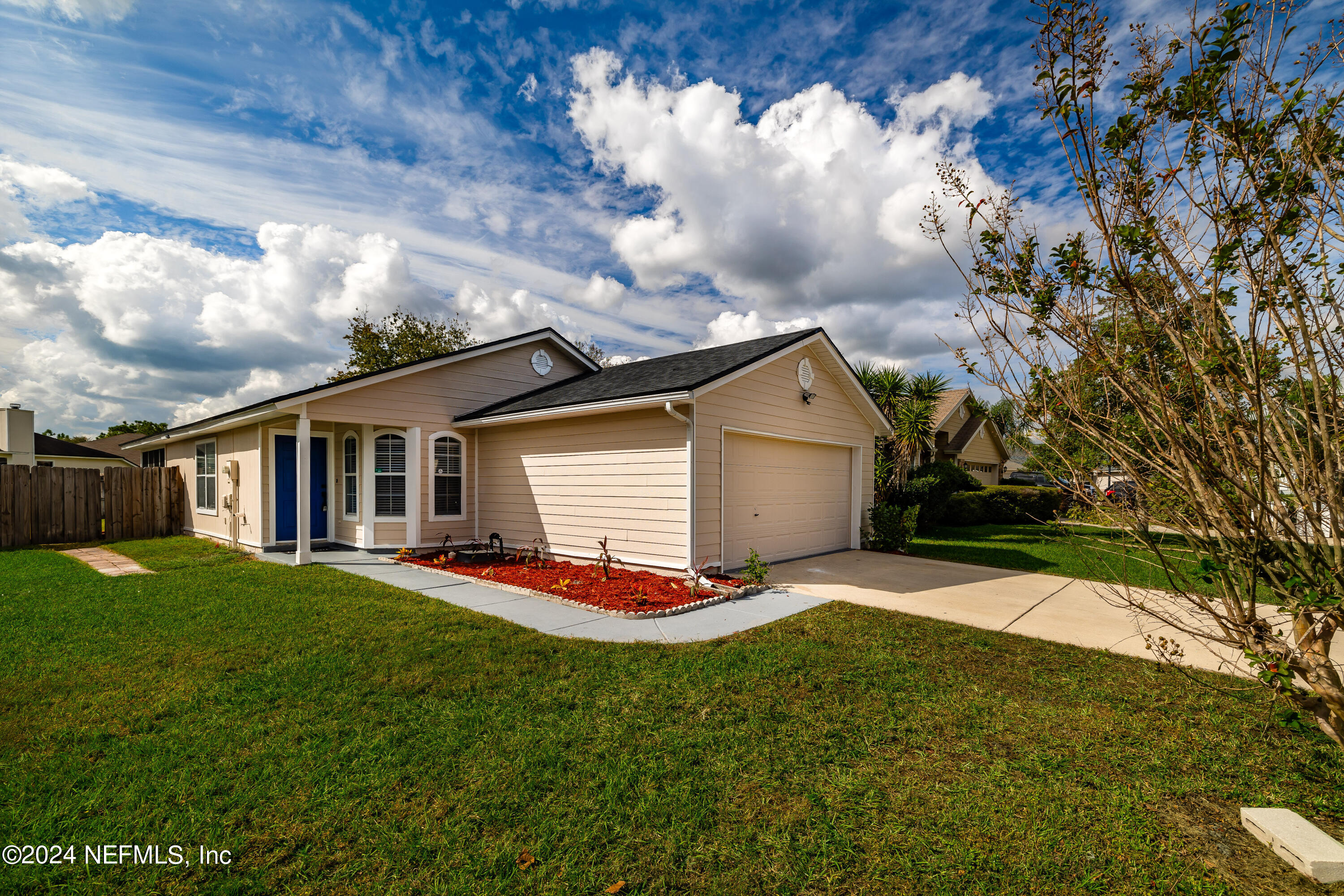 620 Morning Mist Way Orange Park, FL 32073 - Photo 1 of 34 a front view of house with yard and green space