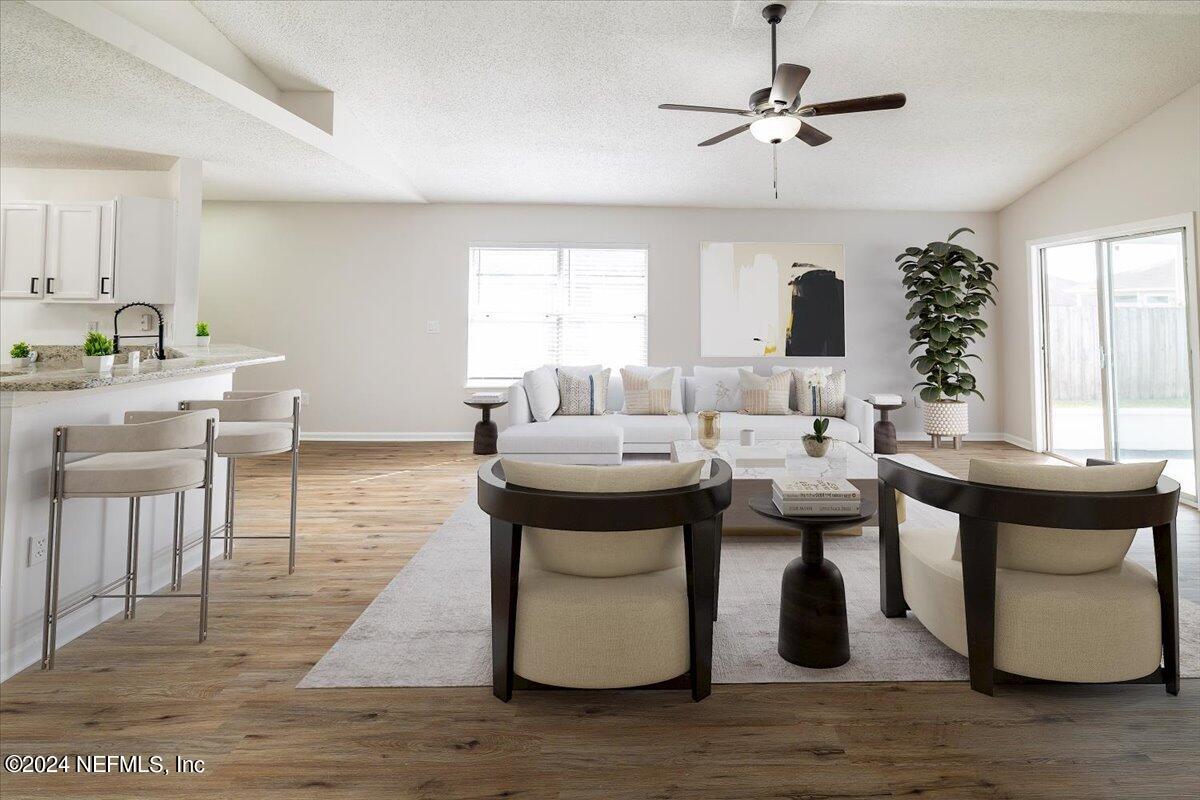 620 Morning Mist Way Orange Park, FL 32073 - Photo 11 of 34 a living room with fireplace furniture and a table