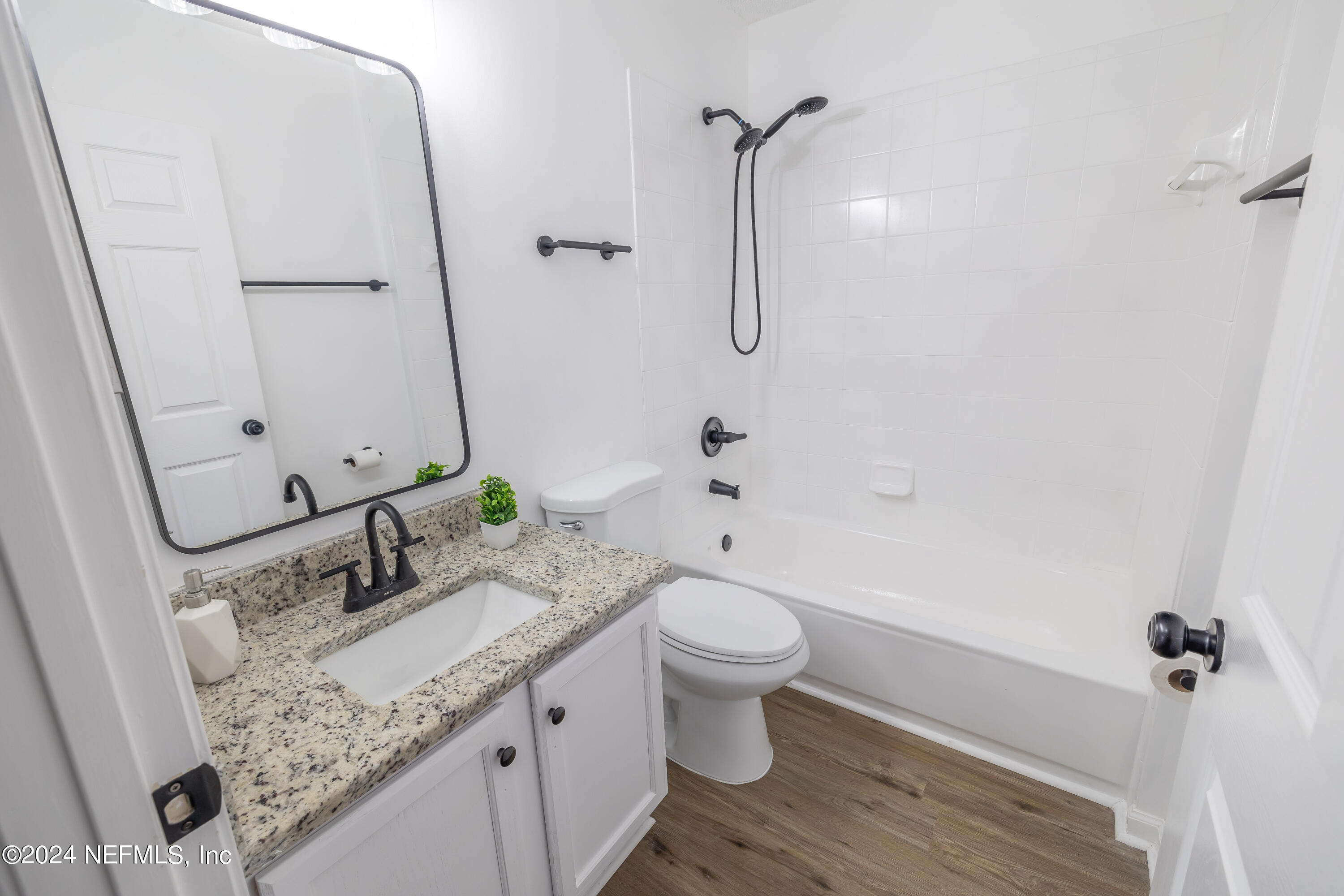 620 Morning Mist Way Orange Park, FL 32073 - Photo 22 of 34 a bathroom with a granite countertop sink toilet and shower
