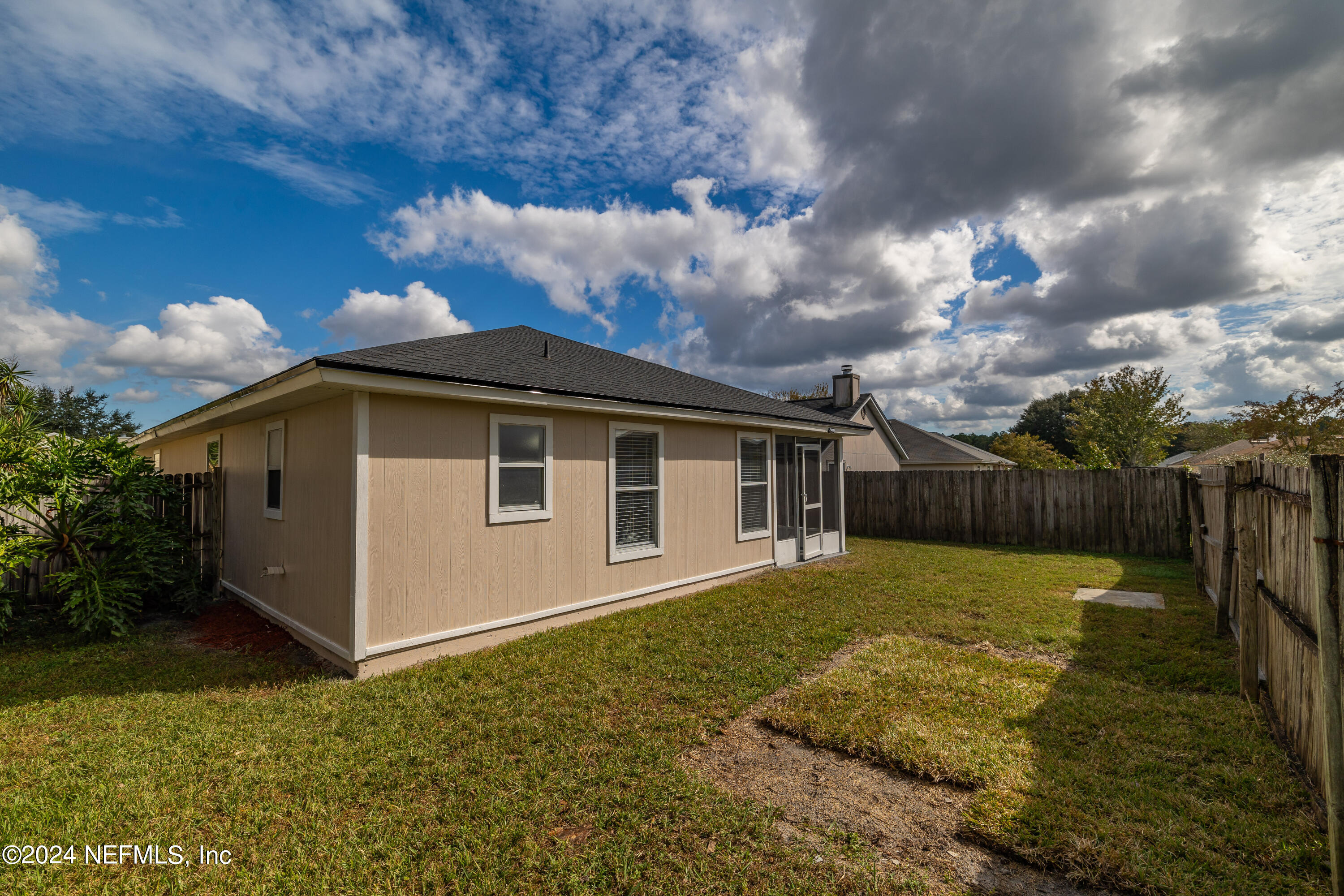 620 Morning Mist Way Orange Park, FL 32073 - Photo 24 of 34 a front view of a house with a yard