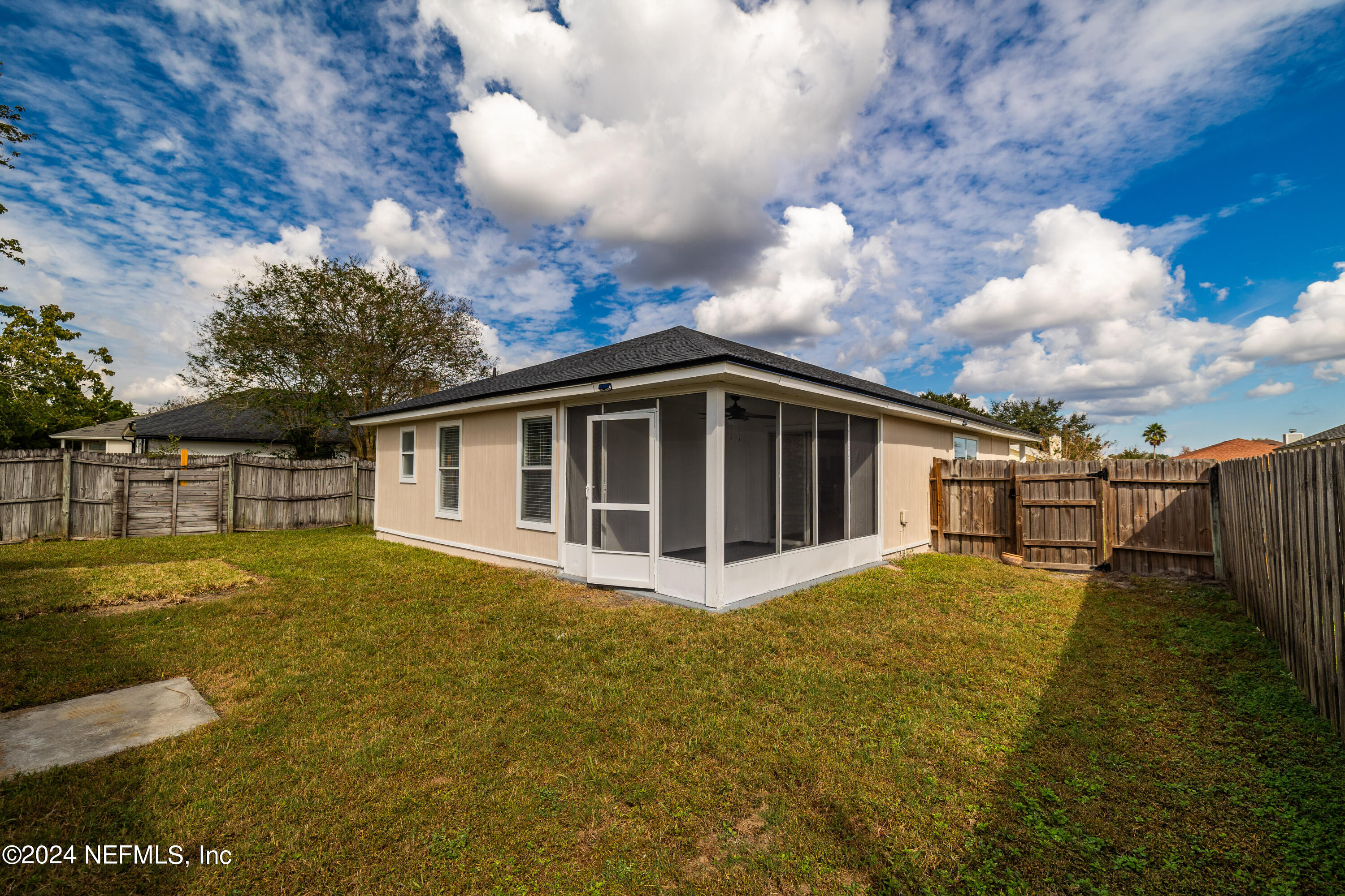 620 Morning Mist Way Orange Park, FL 32073 - Photo 25 of 34 a view of a house with pool and yard