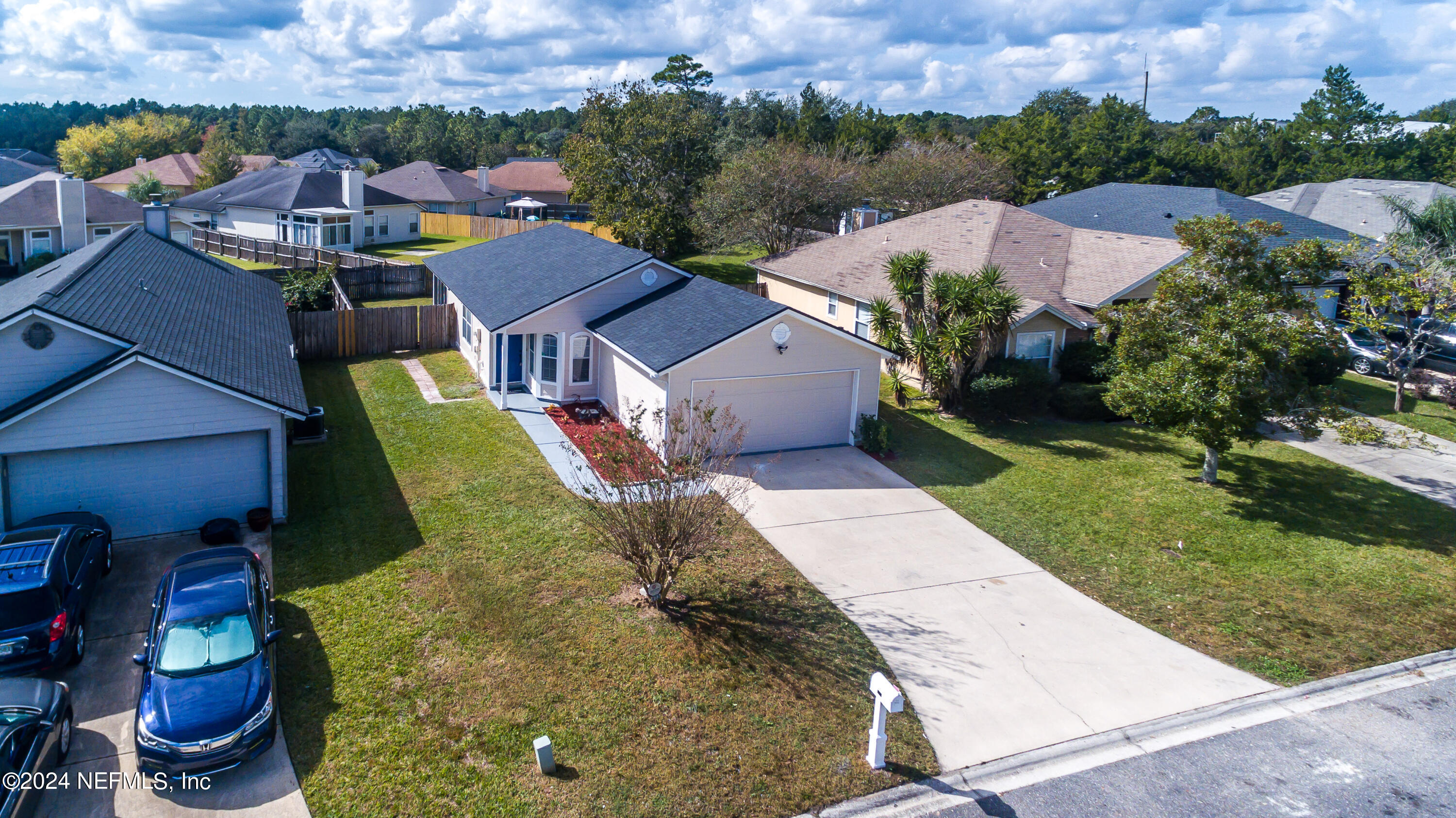 620 Morning Mist Way Orange Park, FL 32073 - Photo 31 of 34 an aerial view of a house with a garden