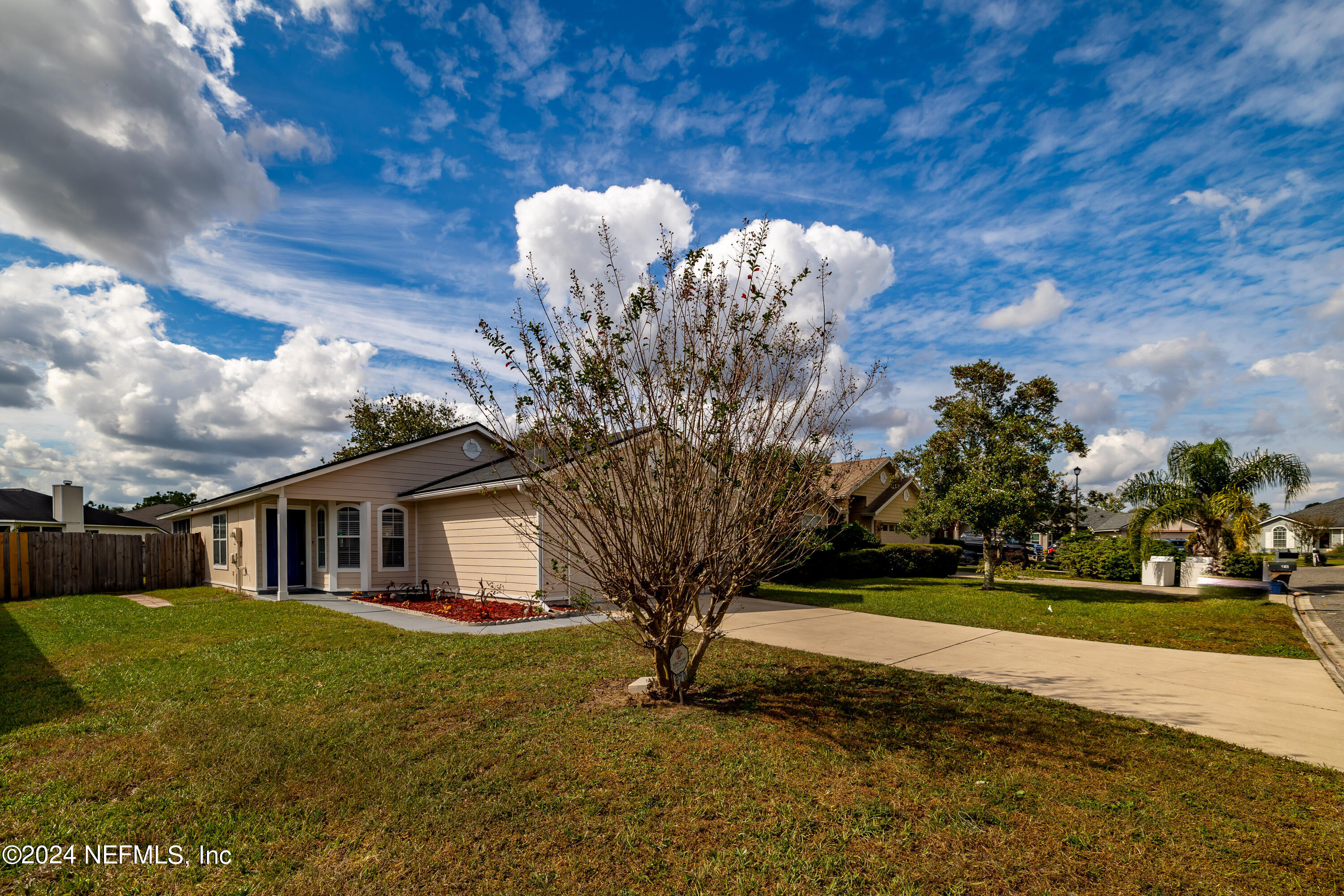620 Morning Mist Way Orange Park, FL 32073 - Photo 33 of 34 a front view of a house with garden