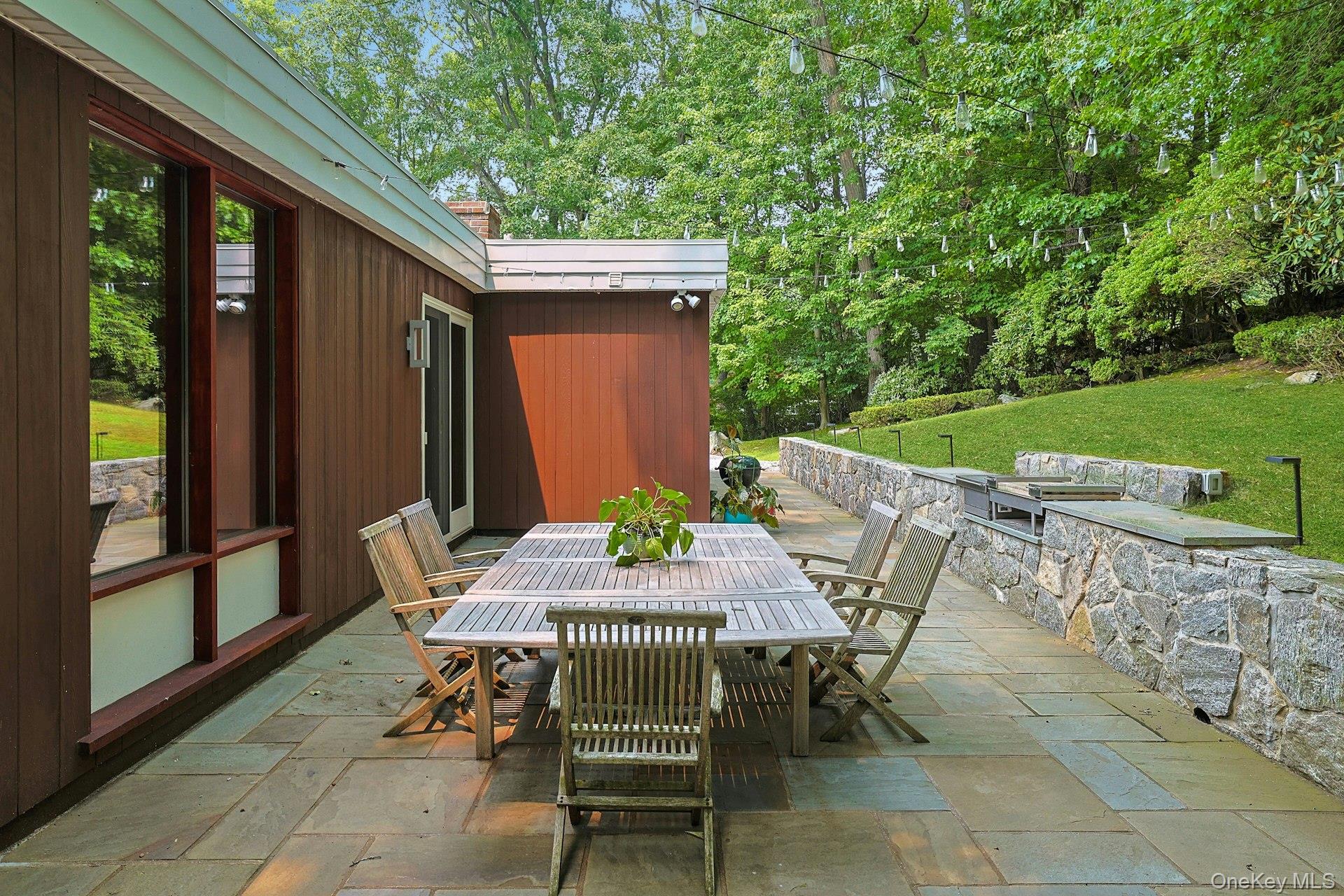 20 Sprain Valley Road Scarsdale, NY 10583 - Photo 24 of 30 Sliding doors from the breakfast room create a seamless connection between indoor living and this beautifully designed outdoor entertaining space.