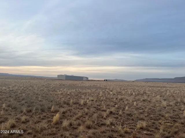 a view of a car is parked in front of a building