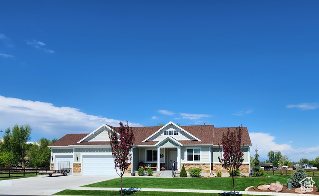 93 East 4030th Street South Logan, UT 84321 - Photo 1 of 1 View of front of property with a porch and a front lawn