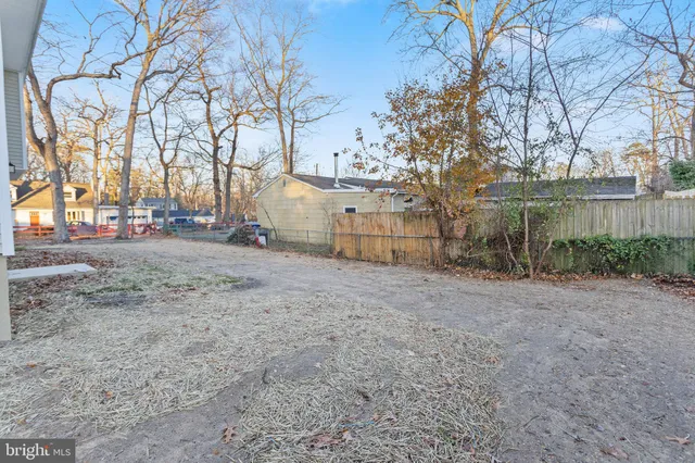 a view of a backyard of the house