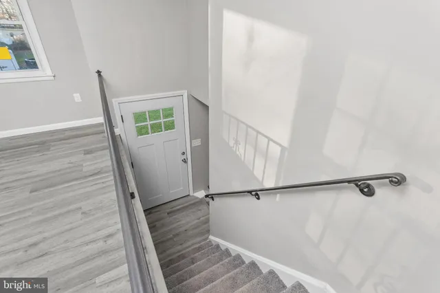 a view of entryway with wooden floor