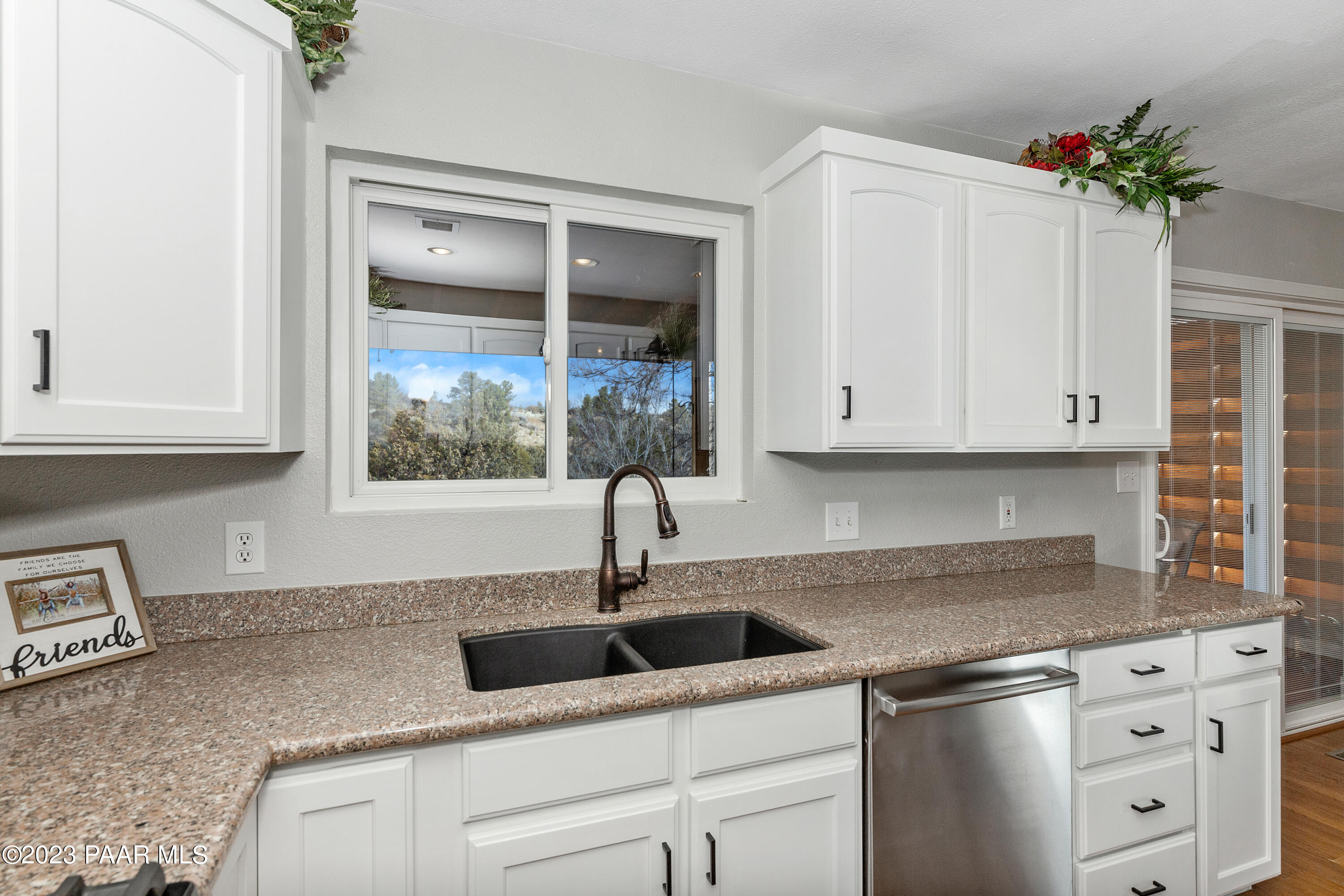 450 Valley Place Prescott, AZ 86301 - Photo 14 of 44 a kitchen with white cabinets and a window