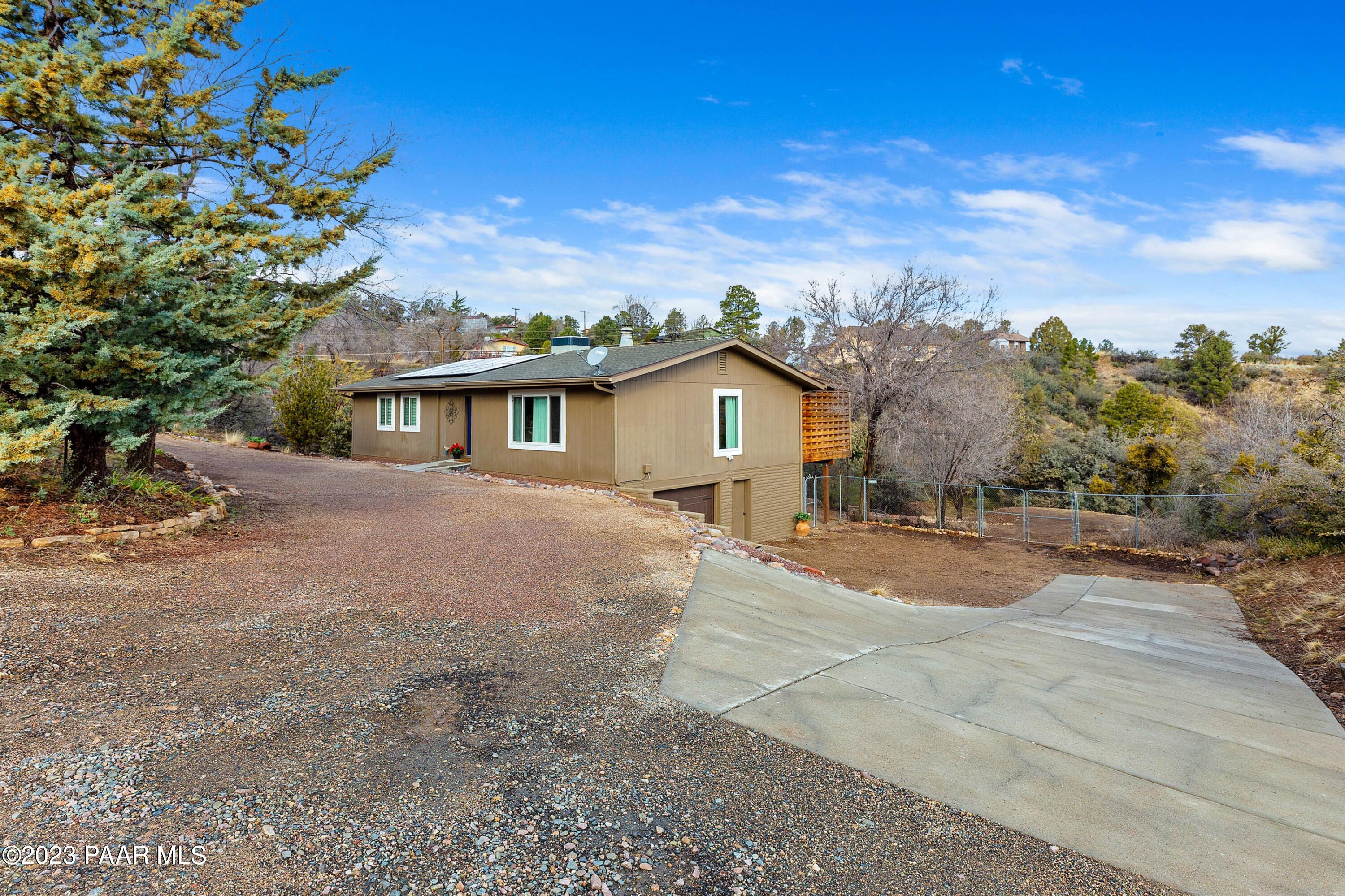450 Valley Place Prescott, AZ 86301 - Photo 2 of 44 a view of house with outdoor space and garden