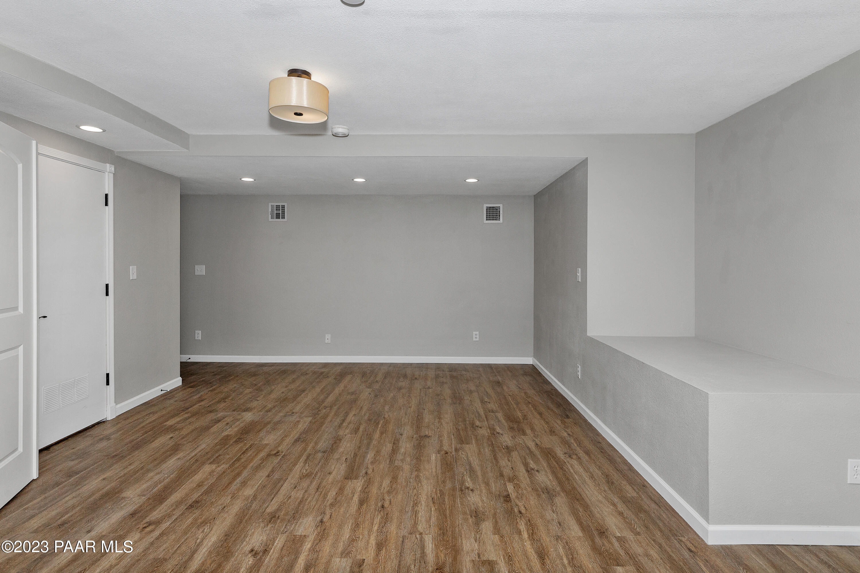 450 Valley Place Prescott, AZ 86301 - Photo 28 of 44 a view of an empty room with wooden floor and a window
